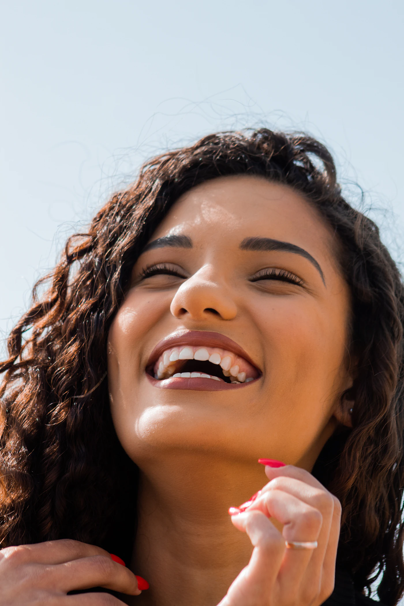 Woman laughing in the sunlight
